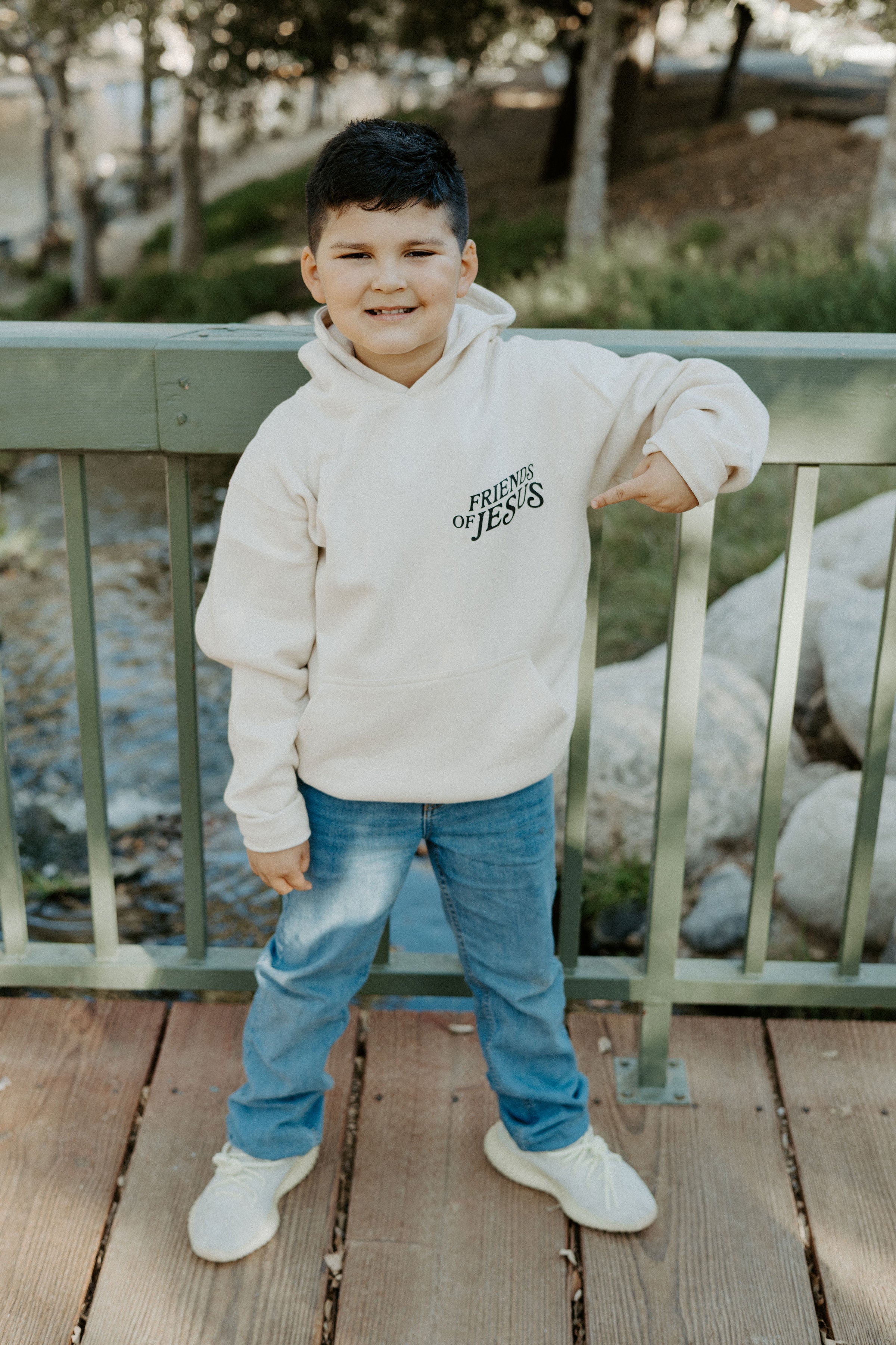 Close-up of the “What a Friend We Have in Jesus” design on a Christian children’s hoodie.