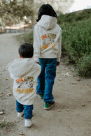 Child wearing a Christian hoodie with “The Lord Is My Shepherd” printed on the back.
