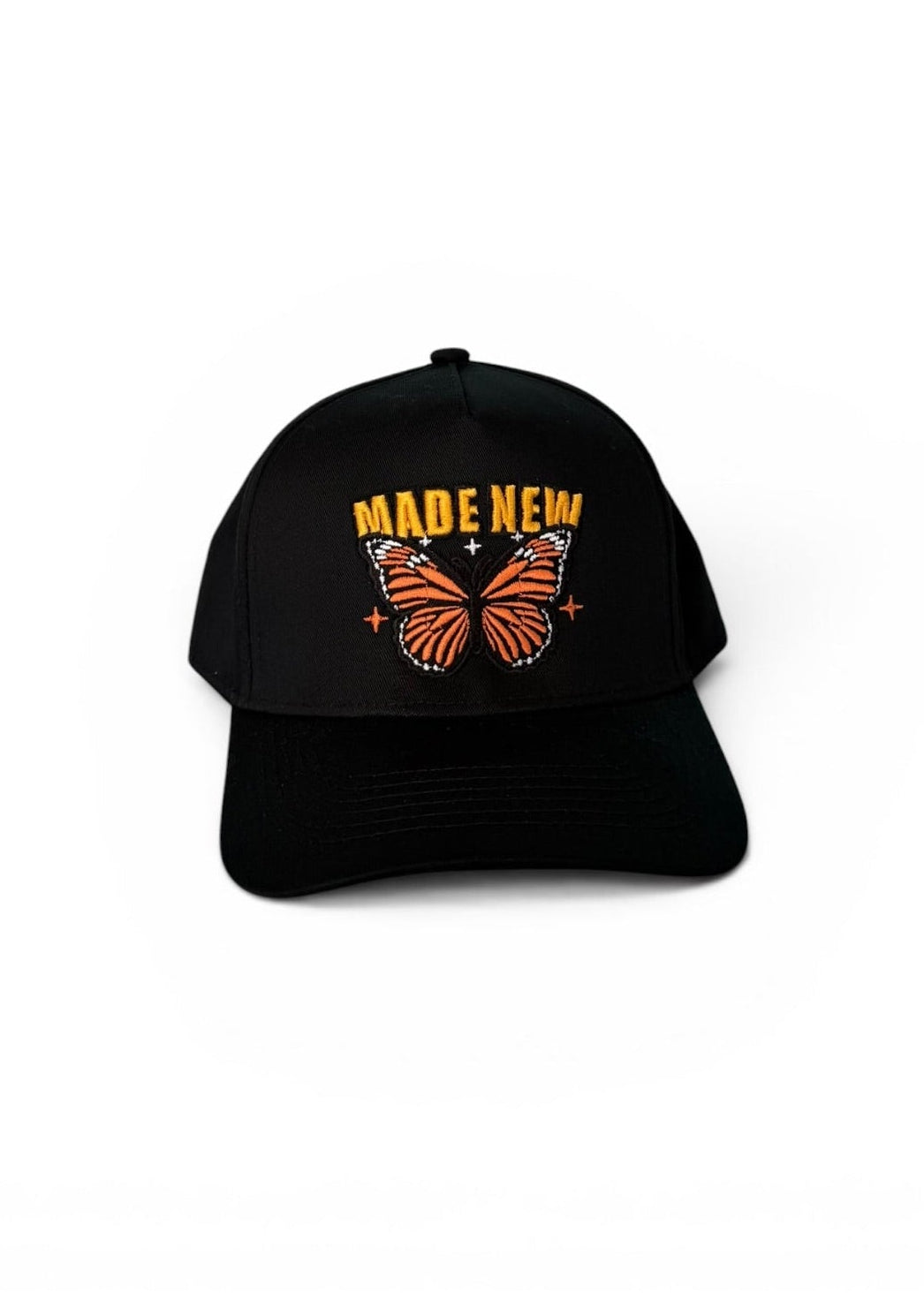 Black cap with butterfly design and 'MADE NEW' text on a white background