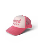 Pink and white cap with 'Loved by Grace' text on a white background