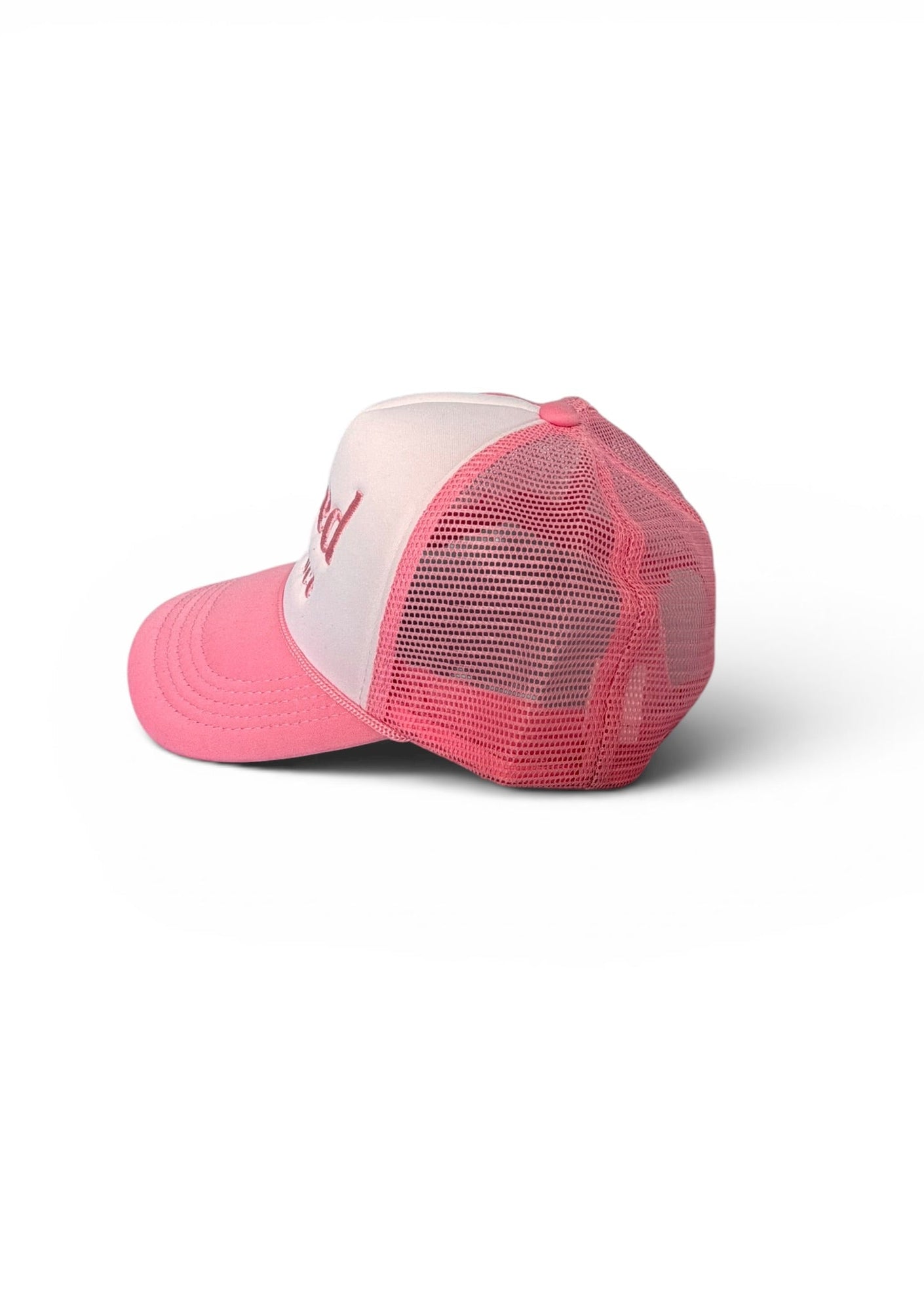Pink and white cap on a white background