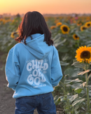 Child wearing a Christian kids hoodie with the message “Child of God” printed on the back.