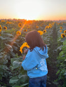 Back view of kids hoodie featuring the faith message “Child of God” in a Christian design.