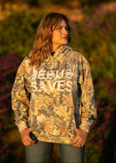 Person wearing a camouflage hoodie with 'JESUS SAVES' text in an outdoor setting